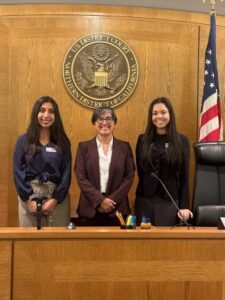 2024 JIA Interns Mia Garcia (left) and Cassidy Graff (right) with Magistrate Judge Lisa Cisneros, 2024 Host Judge